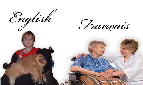 Image: two people in a wheelchairs.  The first person has a dog on her lap, the second person is speaking with a nurse.